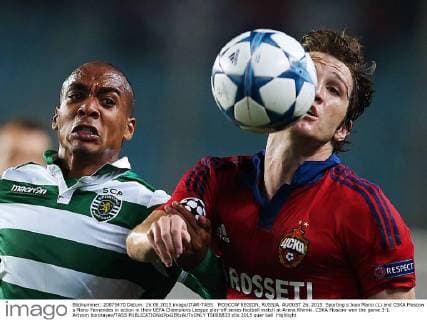 MOSCOW REGION, RUSSIA. AUGUST 26, 2015. Sporting s Joao Mario (L) and CSKA Moscow s Mario Fernandes in action in their UEFA Champions League play-off series football match at Arena Khimki. CSKA Moscow won the game 3-1. Artyom Korotayev TASS  TS00B833