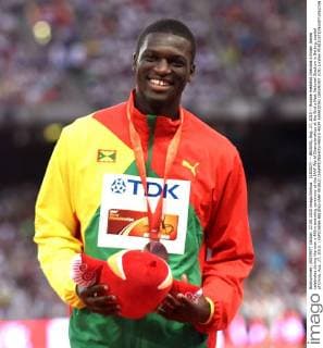 (150827) -- BEIJING, Aug. 27, 2015 -- Bronze medalist Grenada s Kirani James celebrates during the men s 400m awarding ceremony at the IAAF World Championships at the Bird s Nest Naitonal Stadium in Beijing, capital of China, Aug. 27, 2015. ) (SP)CHINA-BEIJING-IAAF WORLD CHAMPIONSHIPS-MEN S 400M AWARDING CEREMONY (CN) LixWen 