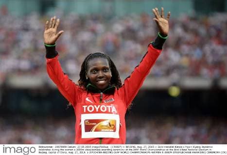 (150827) -- BEIJING, Aug. 27, 2015 -- Gold medalist Kenya s Hyvin Kiyeng Jepkemoi celebrates during the women s 3000m steeplechase awarding ceremony at the IAAF World Championships at the Bird s Nest Naitonal Stadium in Beijing, capital of China, Aug. 27, 2015. ) (SP)CHINA-BEIJING-IAAF WORLD CHAMPIONSHIPS-WOMEN S 3000M STEEPLECHASE AWARDING CEREMONY (CN) LixWen 