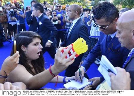 Aug. 27, 2015 - Monaco, Monaco - Real Madrid forward CRISTIANO RONALDO autographing for fans while walking in the Forum Grimaldi Blue Carpet to attend the best Europe soccer player election 2015. Soccer 2015 - UEFA Champions League 2015 - 16 Draws  - ZUMAm119