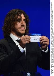 Aug. 27, 2015 - Monaco, Monaco - CARLES PUYOL shows the draw result of Olympiacos FC during the UEFA Champions League Draws 2015 - 16 at Grimaldi Forum. Soccer 2015 - UEFA Champions League 2015 - 16 Draw  - ZUMAm119