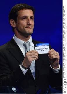 Aug. 27, 2015 - Monaco, Monaco - JULIANO BELLETTI ex Barcelona soccer player shows the draw result of Manchester City FC during the UEFA Champions League Draws 2015 - 16 at Grimaldi Forum. Soccer 2015 - UEFA Champions League 2015 - 16 Draw  - ZUMAm119