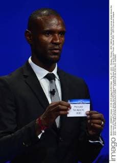 Aug. 27, 2015 - Monaco, Monaco - ERIC ABIDAL ex Barcelona soccer player shows the draw result of Maccabi Tel-Aviv during the UEFA Champions League Draws 2015 - 16 at Grimaldi Forum. Soccer 2015 - UEFA Champions League 2015 - 16 Draw  - ZUMAm119