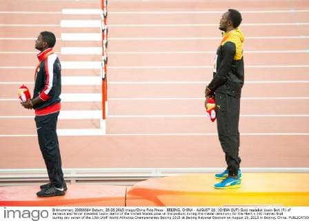 BEIJING, CHINA - AUGUST 28: (CHINA OUT) Gold medalist Usain Bolt (R) of Jamaica and Silver medalist Justin Gatlin of the United States pose on the podium during the medal ceremony for the Men s 200 metres final during day seven of the 15th IAAF World Athletics Championships Beijing 2015 at Beijing National Stadium on August 28, 2015 in Beijing, China.  CFP471986684 