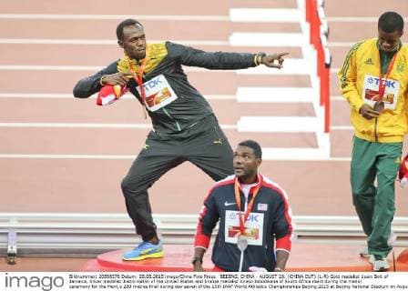 BEIJING, CHINA - AUGUST 28: (CHINA OUT) (L-R) Gold medalist Usain Bolt of Jamaica, Silver medalist Justin Gatlin of the United States and bronze medalist Anaso Jobodwana of South Africa react during the medal ceremony for the Men s 200 metres final during day seven of the 15th IAAF World Athletics Championships Beijing 2015 at Beijing National Stadium on August 28, 2015 in Beijing, China.  CFP471986690 