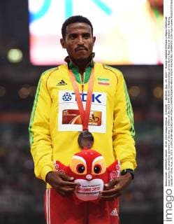 (150829) -- BEIJING, Aug. 29, 2015 -- Bronze medalist Ethiopia s Hagos Gebrhiwet poses during the awarding ceremony of the men s 5000m at the 2015 IAAF World Championships at the Bird s Nest National Stadium in Beijing, capital of China, Aug. 29, 2015. ) (SP)CHINA-BEIJING-IAAF WORLD CHAMPIONSHIPS-MEN S 5000M AWARDING CEREMONY (CN) YuexYuewei 
