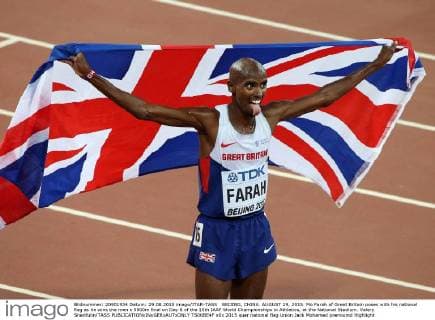 BEIJING, CHINA. AUGUST 29, 2015. Mo Farah of Great Britain poses with his national flag as he wins the men s 5000m final on Day 8 of the 15th IAAF World Championships in Athletics, at the National Stadium. Valery Sharifulin TASS  TS00BE4F