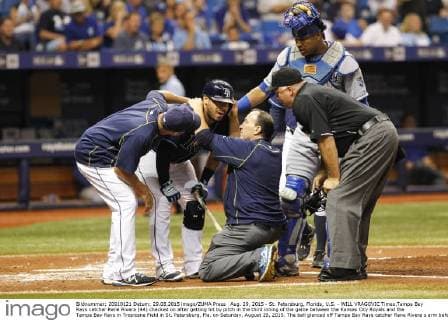 Aug. 29, 2015 - St. Petersburg, Florida, U.S. - WILL VRAGOVIC Times.Tampa Bay Rays catcher Rene Rivera (44) checked on after getting hit by pitch in the third inning of the game between the Kansas City Royals and the Tampa Bay Rays in Tropicana Field in St. Petersburg, Fla. on Saturday, August 29, 2015. The ball glanced off Tampa Bay Rays catcher Rene Rivera s arm before hitting him in the face, and he stayed in the game. Florida News - Aug. 29, 2015 - ZUMAs70_