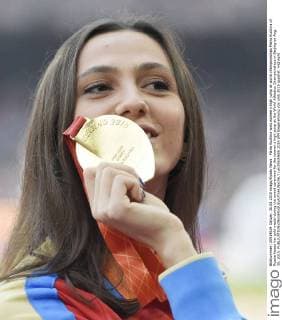 Maria Kuchina wins women s high jump at world championships Maria Kuchina of Russia kisses her gold medal during the award ceremony for the women s high jump at the World Athletics Championships in Beijing on Aug. 30, 2015. 