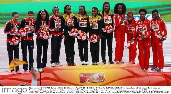BEIJING, CHINA. AUGUST 30, 2015. Silver medalists, US athletes, Gold medalist, Jamaica s athletes and Bronze medalists, athletes (L-R) of Trinidad and Tobago during an awards ceremony for the women s 4x100m relay final at the 15th IAAF World Championships in Athletics at Beijing National Stadium. Vladimir Smirnov TASS  TS00BF36