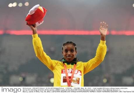 (150830) -- BEIJING, Aug. 30, 2015 -- Gold medalist Ethiopia s Almaz Ayana celebrates during the awarding ceremony of the women s 5000m event at the 2015 IAAF World Championships at the Bird s Nest National Stadium in Beijing, capital of China, Aug. 30, 2015. ) (SP)CHINA-BEIJING-IAAF WORLD CHAMPIONSHIPS-WOMEN S 5000M AWARDING CEREMONY (CN) YuexYuewei 