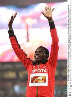 (150830) -- BEIJING, Aug. 30, 2015 -- Silver medalist Kenya s Helah Kiprop celebrates during the awarding ceremony of the women s marathon event at the 2015 IAAF World Championships at the Bird s Nest National Stadium in Beijing, capital of China, Aug. 30, 2015. ) (SP)CHINA-BEIJING-IAAF WORLD CHAMPIONSHIPS-WOMEN S MARATHON AWARDING CEREMONY (CN) YuexYuewei 