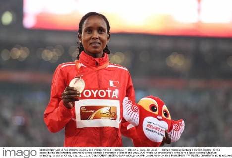 (150830) -- BEIJING, Aug. 30, 2015 -- Bronze medalist Bahrain s Eunice Jepkirui Kirwa poses during the awarding ceremony of the women s marathon event at the 2015 IAAF World Championships at the Bird s Nest National Stadium in Beijing, capital of China, Aug. 30, 2015. ) (SP)CHINA-BEIJING-IAAF WORLD CHAMPIONSHIPS-WOMEN S MARATHON AWARDING CEREMONY (CN) YuexYuewei 