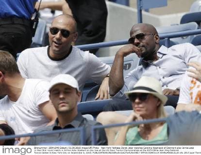 New York Yankees Derek Jeter watches Caroline Wozniacki of Denmark play Jamie Loeb in their first round match in Arthur Ashe Stadium on day two at the US Open Tennis Championships at the USTA Billie Jean King National Tennis Center in New York City on September 1, 2015.  NYP20150901119 JOHNxANGELILLO