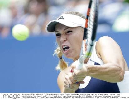 Caroline Wozniacki of Denmark hits a backhand to Jamie Loeb in their first round match in Arthur Ashe Stadium on day two at the US Open Tennis Championships at the USTA Billie Jean King National Tennis Center in New York City on September 1, 2015.  NYP20150901120 JOHNxANGELILLO