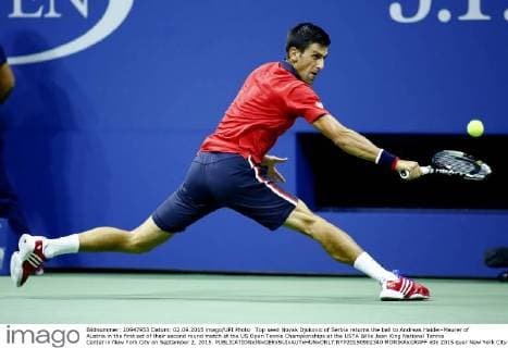 Top seed Novak Djokovic of Serbia returns the ball to Andreas Haider-Maurer of Austria in the first set of their second round match at the US Open Tennis Championships at the USTA Billie Jean King National Tennis Center in New York City on September 2, 2015.  NYP20150902340 MONIKAxGRAFF