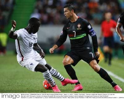 Sept. 4, 2015 - Lisbon, Portugal - France s defender Bacary Sagna (L) vies for the ball with Portugal s forward Cristiano Ronaldo (R) during the friendly football match between Portugal and France at Jose Alvalade Stadium in Lisbon on September 4, 2015. NURPHOTO CARLOS PALMA. FBL-EURO-2016-FRIENDLY-POR-FRA  - ZUMAn230
