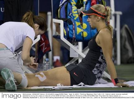 Sept. 5, 2015 - Flushing Meadows, New York, U.S - Sabine Lisicki receives medical assistance during her match on Day Six of the 2015 US Open with Barbora Strykova at the USTA Billie Jean King National Tennis Center on Saturday September 5, 2015 in the Flushing neighborhood of the Queens borough of New York City. Lisicki vs. Strykova - ZUMAp124