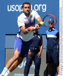 Marin Cilic of Croatia returns the ball to Jeremy Chardy of France in the first set of their fourth round match at the US Open Tennis Championships at the USTA Billie Jean King National Tennis Center in New York City on September 6, 2015.  NYP20150906301 MONIKAxGRAFF