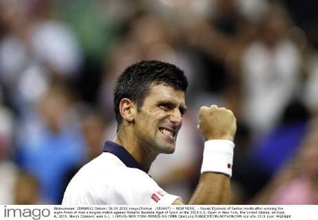 (150907) -- NEW YORK, - Novak Djokovic of Serbia reacts after winning the eight-finals of men s singles match against Roberto Bautista Agut of Spain at the 2015 U.S. Open in New York, the United States, on Sept. 6, 2015. Novak Djokovic won 3-1. ) (SP)US-NEW YORK-TENNIS-US OPEN QinxLang 
