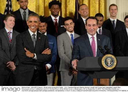 U.S. President Barack Obama shares a laugh with Duke head basketball coach Mike Krzyzewski during a celebration event in the East Room of the White House in Washington, DC on September 8, 2015. The Duke Blue Devils won the NCAA College League USA college basketball championship in March of 2015.  WAP2015090814 PATxBENIC