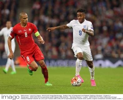 Gokhan Inler of Switzerland and Raheem Sterling of England - England vs Switzerland - UEFA EURO EM Europameisterschaft Fussball 2016 Qualifier - Wembley Stadium - London - 08 09 2015 Pic Philip Oldham SportImage EDITORIAL USE ONLY. No use with unauthorised audio, video, data, fixture lists, club league logos or live services. Online in-match use limited to 120 images, no video emulation. No use in betting, games or single club league player publications.