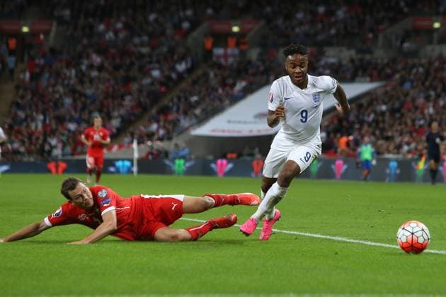Raheem Sterling of England escapes Stephan Lichtsteiner of Switzerland - England vs Switzerland - UEFA EURO EM Europameisterschaft Fussball 2016 Qualifier - Wembley Stadium - London - 08 09 2015 Pic Philip Oldham SportImage EDITORIAL USE ONLY. No use with unauthorised audio, video, data, fixture lists, club league logos or live services. Online in-match use limited to 120 images, no video emulation. No use in betting, games or single club league player publications.