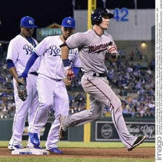 Sept. 8, 2015 - Kansas City, MO, USA - The Minnesota Twins Chris Herrmann, right, is retired at first by Kansas City Royals first baseman Eric Hosmer as pitcher Edinson Volquez, left, looks on after a grounder in the fifth inning on Tuesday, Sept. 8, 2015, at Kauffman Stadium in Kansas City, Mo. Minnesota at Kansas City - ZUMAm67_