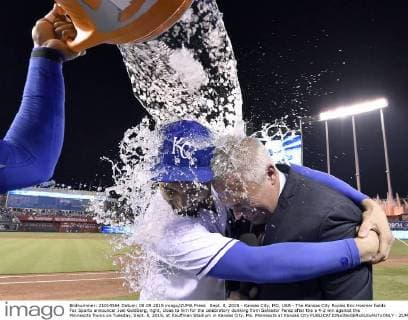 Sept. 8, 2015 - Kansas City, MO, USA - The Kansas City Royals Eric Hosmer holds Fox Sports announcer Joel Goldberg, right, close to him for the celebratory dunking from Salvador Perez after the a 4-2 win against the Minnesota Twins on Tuesday, Sept. 8, 2015, at Kauffman Stadium in Kansas City, Mo. Minnesota at Kansas City - ZUMAm67_