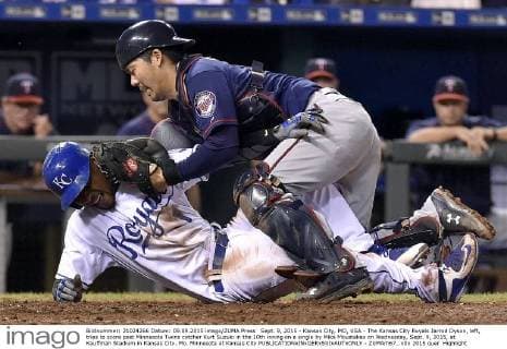 Sept. 9, 2015 - Kansas City, MO, USA - The Kansas City Royals Jarrod Dyson, left, tries to score past Minnesota Twins catcher Kurt Suzuki in the 10th inning on a single by Mike Moustakas on Wednesday, Sept. 9, 2015, at Kauffman Stadium in Kansas City, Mo. Minnesota at Kansas City - ZUMAm67_