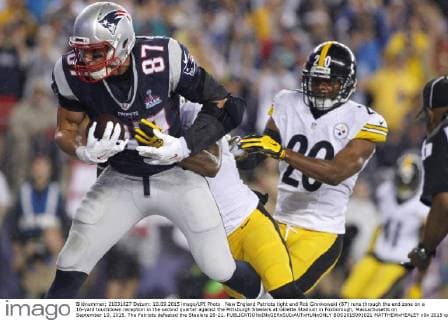 New England Patriots tight end Rob Gronkowski (87) runs through the end zone on a 16-yard touchdown reception in the second quarter against the Pittsburgh Steelers at Gillette Stadium in Foxborough, Massachusetts on September 10, 2015. The Patriots defeated the Steelers 28-21.  BOS2015091021 MATTHEWxHEALEY