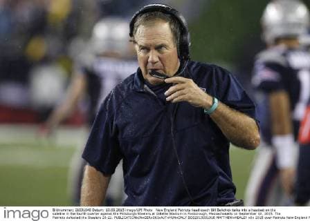 New England Patriots head coach Bill Belichick talks into a headset on the sideline in the fourth quarter against the Pittsburgh Steelers at Gillette Stadium in Foxborough, Massachusetts on September 10, 2015. The Patriots defeated the Steelers 28-21.  BOS2015091018 MATTHEWxHEALEY