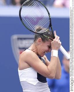 Flavia Pennetta of Italy reacts after defeating Simona Halep of Romania 6-1, 6-3 in the semifinals in Arthur Ashe Stadium at the US Open Tennis Championships at the USTA Billie Jean King National Tennis Center in New York City on September 11, 2015.  NYP20150911135 JOHNxANGELILLO