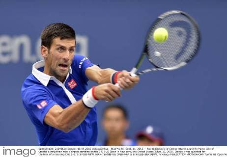 NEW YORK, Sept. 11, 2015 -- Novak Djokovic of Serbia returns a shot to Marin Cilic of Croatia during their men s singles semifinal at the 2015 US Open in New York, the United States, Sept. 11, 2015. Djokovic was qualified for the final after beating Cilic 3-0. ) (SP)US-NEW YORK-TENNIS-US OPEN-MEN S SINGLES-SEMIFINAL YinxBogu 