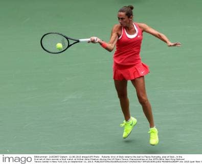 Roberta Vinci of Italy returns the ball to Flavia Pennetta, also of Italy, in the first set of their women s final match at Arthur Ashe Stadium during the US Open Tennis Championships at the USTA Billie Jean King National Tennis Center in New York City on September 12, 2015.  NYP20150912302 MONIKAxGRAFF