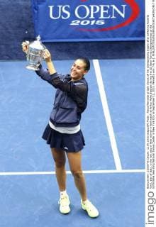 Flavia Pennetta of Italy shows off her championship trophy after defeating Roberta Vinci, also of Italy, in the two sets of their women s final match at Arthur Ashe Stadium during the US Open Tennis Championships at the USTA Billie Jean King National Tennis Center in New York City on September 12, 2015. Pennetta won 7-6, 6-2.  NYP20150912311 MONIKAxGRAFF