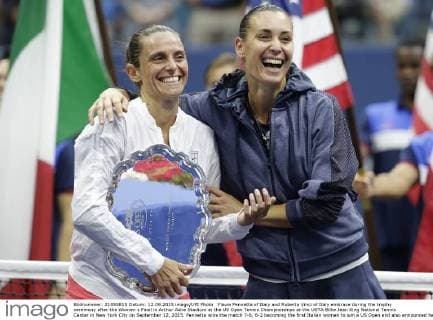 Flavia Pennetta of Italy and Roberta Vinci of Italy embrace during the trophy ceremony after the Women s Final in Arthur Ashe Stadium at the US Open Tennis Championships at the USTA Billie Jean King National Tennis Center in New York City on September 12, 2015. Pennetta wins the match 7-6, 6-2 becoming the first Italian women to win a US Open and also announced her retirement at the Trophy Ceremony.  NYP20150912116 JOHNxANGELILLO
