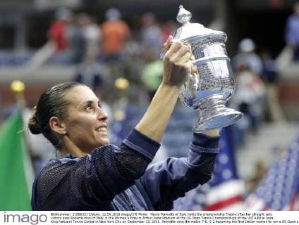Flavia Pennetta of Italy holds the championship Trophy after her straight sets victory over Roberta Vinci of Italy in the Women s Final in Arthur Ashe Stadium at the US Open Tennis Championships at the USTA Billie Jean King National Tennis Center in New York City on September 12, 2015. Pennetta wins the match 7-6, 6-2 becoming the first Italian women to win a US Open and also announced her possible retirement at the Trophy Ceremony.  NYP20150912122 JOHNxANGELILLO
