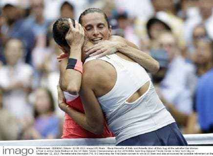 Flavia Pennetta of Italy and Roberta Vinci of Italy hug at the net after the Women s Final in Arthur Ashe Stadium at the US Open Tennis Championships at the USTA Billie Jean King National Tennis Center in New York City on September 12, 2015. Pennetta wins the match 7-6, 6-2 becoming the first Italian women to win a US Open and also announced her possible retirement at the Trophy Ceremony.  NYP20150912127 JOHNxANGELILLO