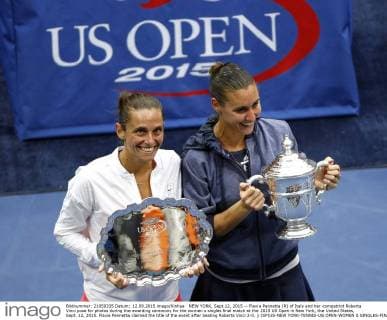 NEW YORK, Sept.12, 2015 -- Flavia Pennetta (R) of Italy and her compatriot Roberta Vinci pose for photos during the awarding ceremony for the women s singles final match at the 2015 US Open in New York, the United States, Sept. 12, 2015. Flavia Pennetta claimed the title of the event after beating Roberta Vinci 2-0. ) (SP)US-NEW YORK-TENNIS-US OPEN-WOMEN S SINGLES-FINAL QinxLang 
