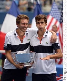 NEW YORK, Sept.12, 2015 -- Pierre-Hugues Herbert (R) and Nicolas Mahut of France pose for photos during the awarding ceremony for the men s doubles final match at the 2015 US Open in New York, the United States, Sept. 12, 2015. The French pair claimed the title of the event after beating Jamie Murray of Great Britain and John Peers of Australia 2-0. ) (SP)US-NEW YORK-TENNIS-US OPEN-MEN S DOUBLES-FINAL YinxBogu 