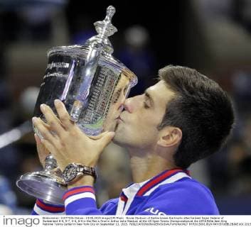 Novak Djokovic of Serbia kisses the trophy after he beat Roger Federer of Switzerland 6-4, 5-7, 6-4, 6-4 in the Men s Final in Arthur Ashe Stadium at the US Open Tennis Championships at the USTA Billie Jean King National Tennis Center in New York City on September 13, 2015.  NYP20150913824 RAYxSTUBBLEBINE
