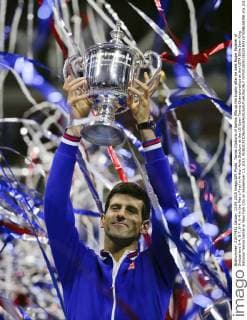 Novak Djokovic of Serbia lifts up the trophy after he beat Roger Federer of Switzerland 6-4, 5-7, 6-4, 6-4 in the Men s Final in Arthur Ashe Stadium at the US Open Tennis Championships at the USTA Billie Jean King National Tennis Center in New York City on September 13, 2015.  NYP201509138229 RAYxSTUBBLEBINE