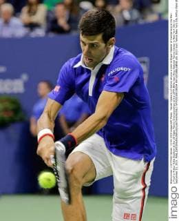 Novak Djokovic of Serbia returns a shot to Roger Federer of Switzerland in the Men s Final in Arthur Ashe Stadium at the US Open Tennis Championships at the USTA Billie Jean King National Tennis Center in New York City on September 13, 2015.  NYP201509138354 RAYxSTUBBLEBINE