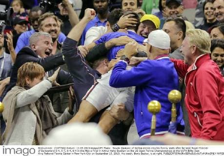 Novak Djokovic of Serbia climbs into his family seats after he beat Roger Federer of Switzerland 6-4, 5-7, 6-4, 6-4 in the Men s Final in Arthur Ashe Stadium at the US Open Tennis Championships at the USTA Billie Jean King National Tennis Center in New York City on September 13, 2015. His coach, Boris Becker, is at right.  NYP20150913837 RAYxSTUBBLEBINE
