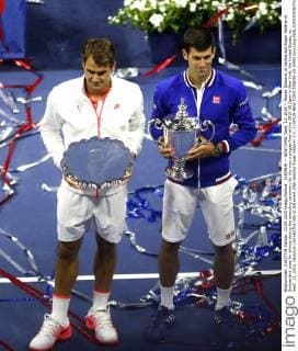 (150914) -- NEW YORK, Sept. 13, 2015 -- Novak Djokovic of Serbia and Roger Federer of Switzerland pose for photos during the awarding ceremony for the men s singles final at the 2015 US Open in New York, the United States, on Sept. 13, 2015. Djokovic claimed the title of the event after beating Roger Federer 3-1. ) (SP)US-NEW YORK-TENNIS-US OPEN QinxLang 