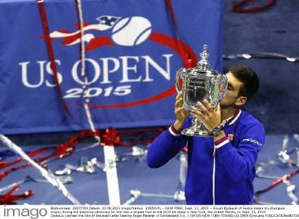 (150914) -- NEW YORK, Sept. 13, 2015 -- Novak Djokovic of Serbia kisses his champion trophy during the awarding ceremony for the men s singles final at the 2015 US Open in New York, the United States, on Sept. 13, 2015. Djokovic claimed the title of the event after beating Roger Federer of Switzerland 3-1. ) (SP)US-NEW YORK-TENNIS-US OPEN QinxLang 