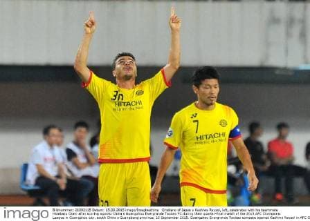 Cristiano of Japan s Kashiwa Reysol, left, celebrates with his teammate Hidekazu Otani after scoring against China s Guangzhou Evergrande Taobao FC during their quarter-final match of the 2015 AFC Champions League in Guangzhou city, south China s Guangdong province, 15 September 2015. Guangzhou Evergrande Taobao compete against Kashiwa Reysol in AFC Champions League  20150915_32055