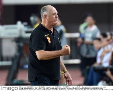 (150915) -- GUANGZHOU , Sep. 15, 2015 -- Guangzhou Evergrande coach Luiz Felipe Scolari celebrates victory after the AFC Champions League quarter-final second leg match between China s Guangzhou Evergrande and Japan s Kashiwa Reysol at Guangzhou Tianhe Sports Centre in Guangzhou, south China s Guangdong Province, Sept. 15, 2015. The match ended with a 1-1 draw and Guangzhou Evergrande advanced to the semifinal with 4-2 in aggregate. )(wll) (SP)CHINA-GUANGZHOU-SOCCER-AFC CHAMPIONS LEAGUE-QUARTERFINAL LiuxDawei 