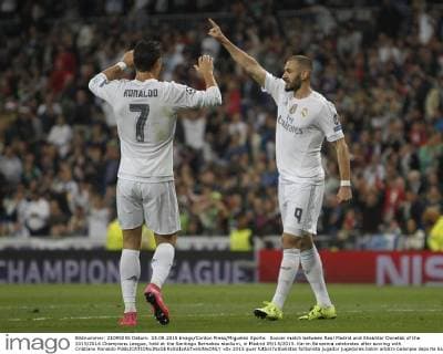 Soccer match between Real Madrid and Shakhtar Donetsk of the 2015 2016 Champions League, held at the Santiago Bernabeu stadium, in Madrid 09 15 2015. Karim Benzema celebrates after scoring with Cristiano Ronaldo 